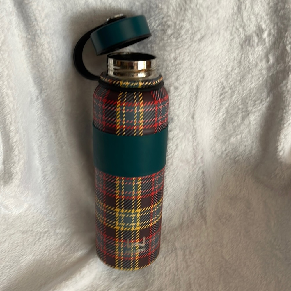 Stainless steel water bottle by Wellness.